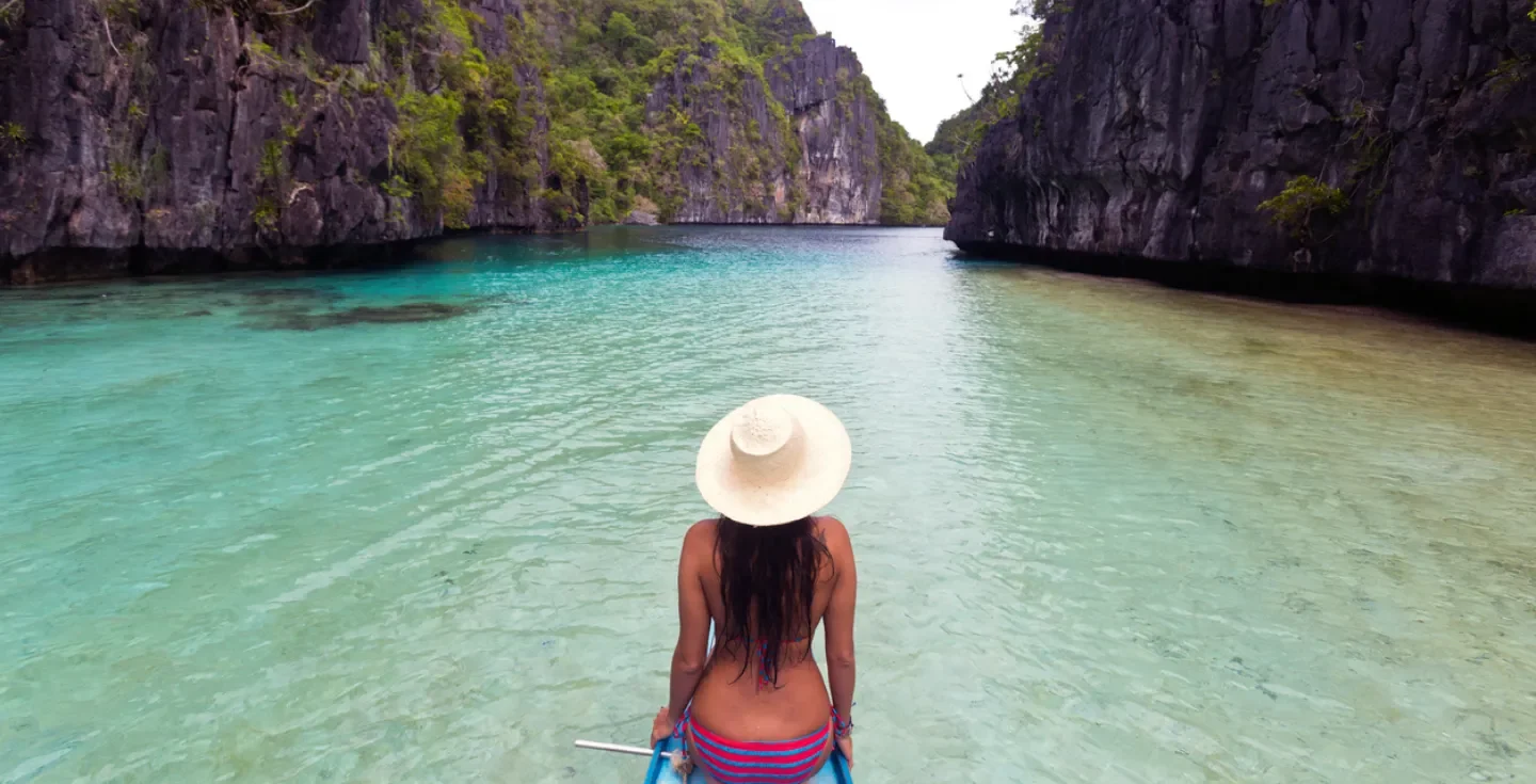 Traveler enjoying turquoise waters in the Philippines