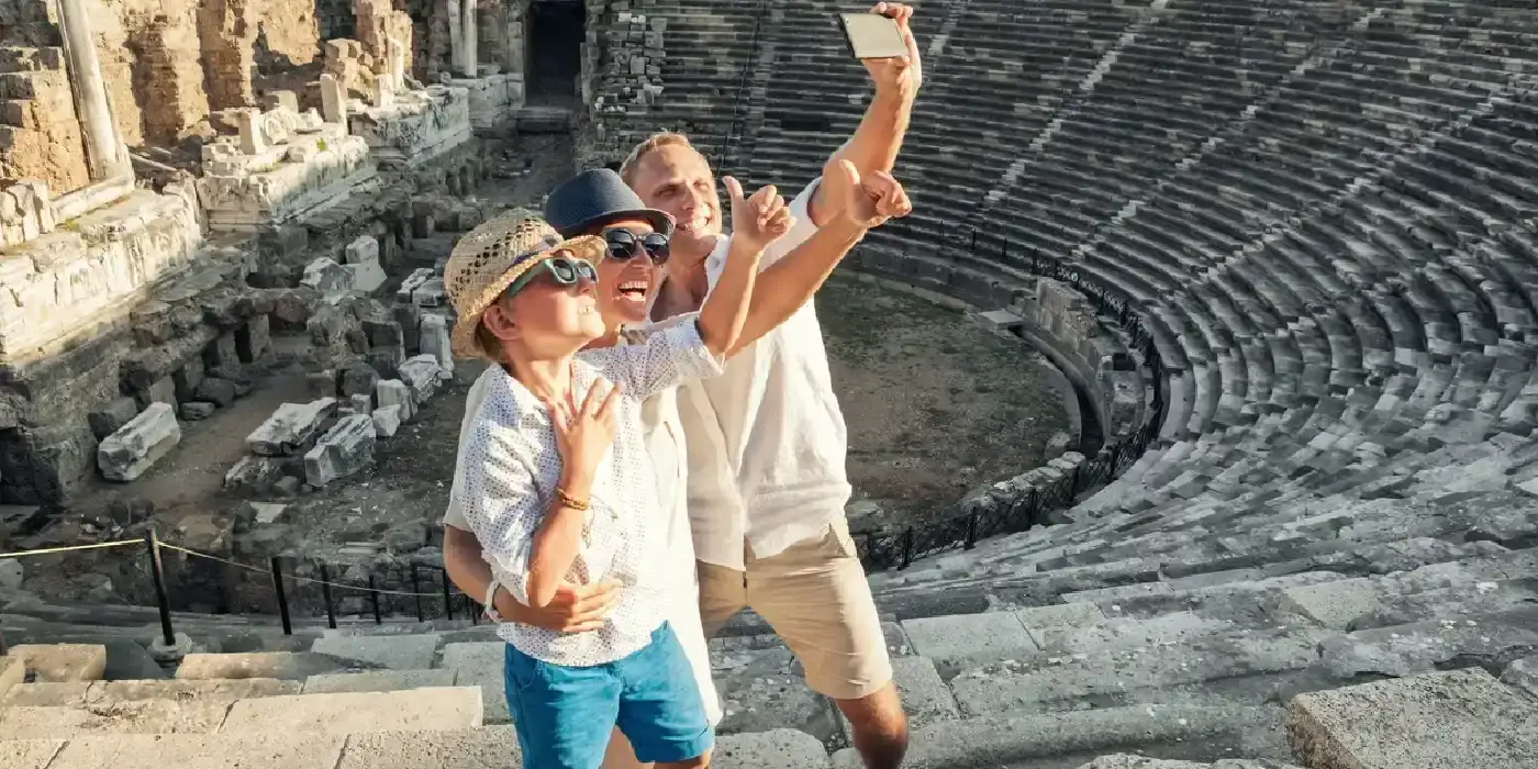Cheerful family at Side’s ancient theater in Turkey.