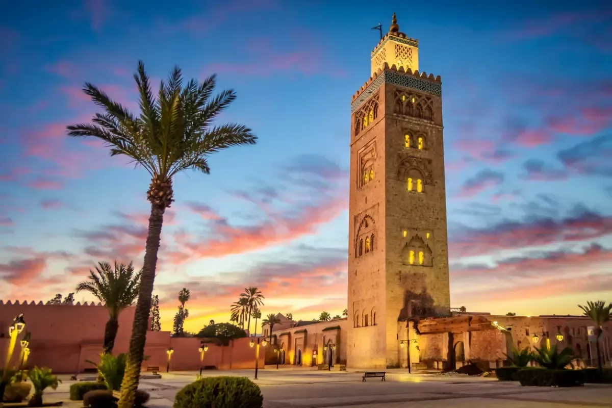 Koutoubia mosque in the morning surrounded by palm tree, Marrakesh, Morocco. UNESCO Sites in Morocco 
