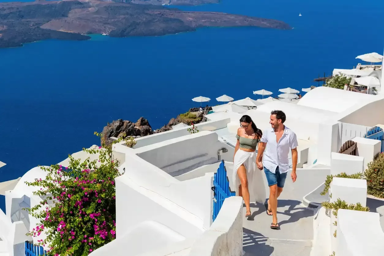 An American couple in Santorini on a romantic trip.