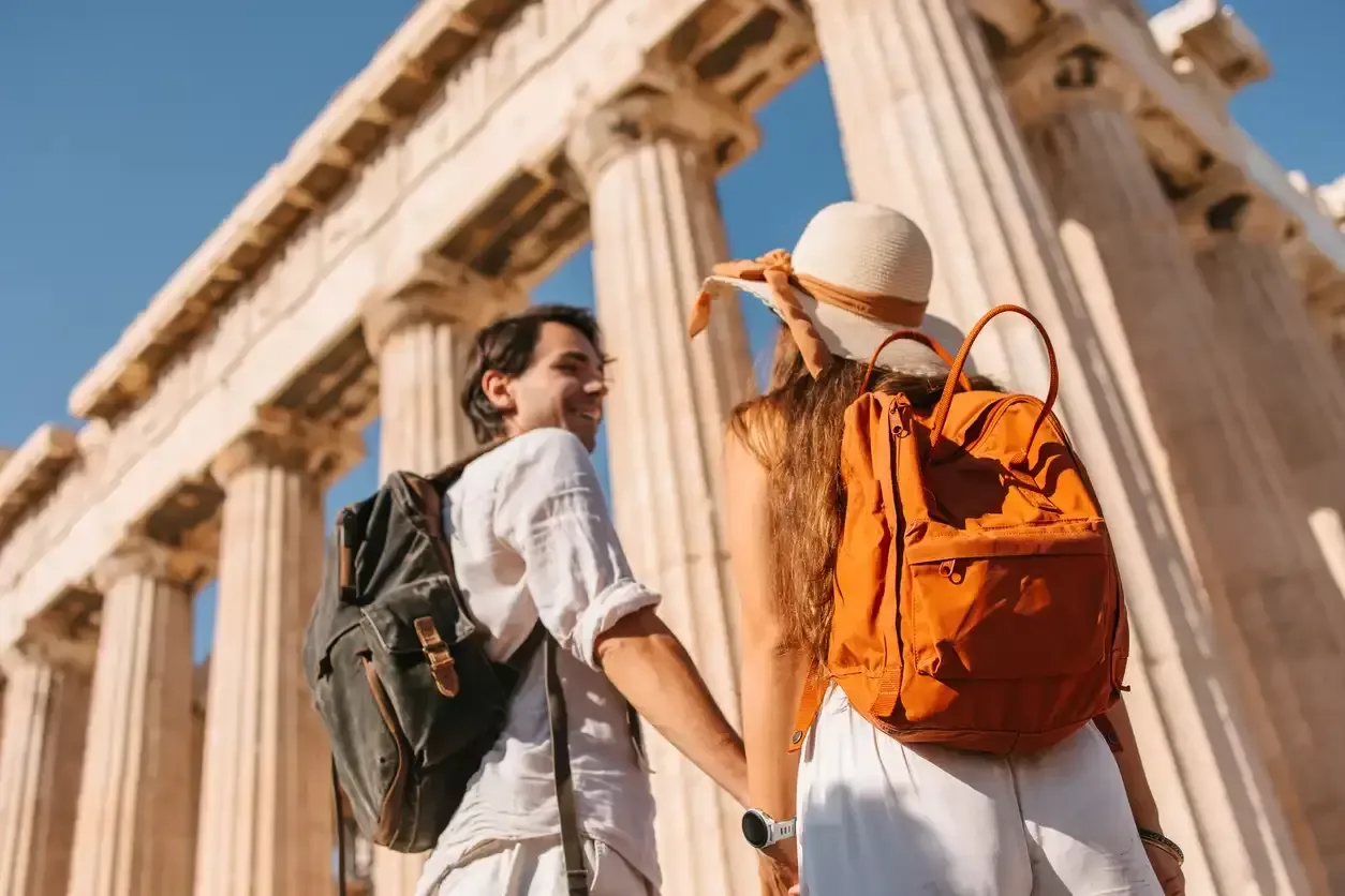 An Australian couple admires the Parthenon from the Acropolis in Athens.