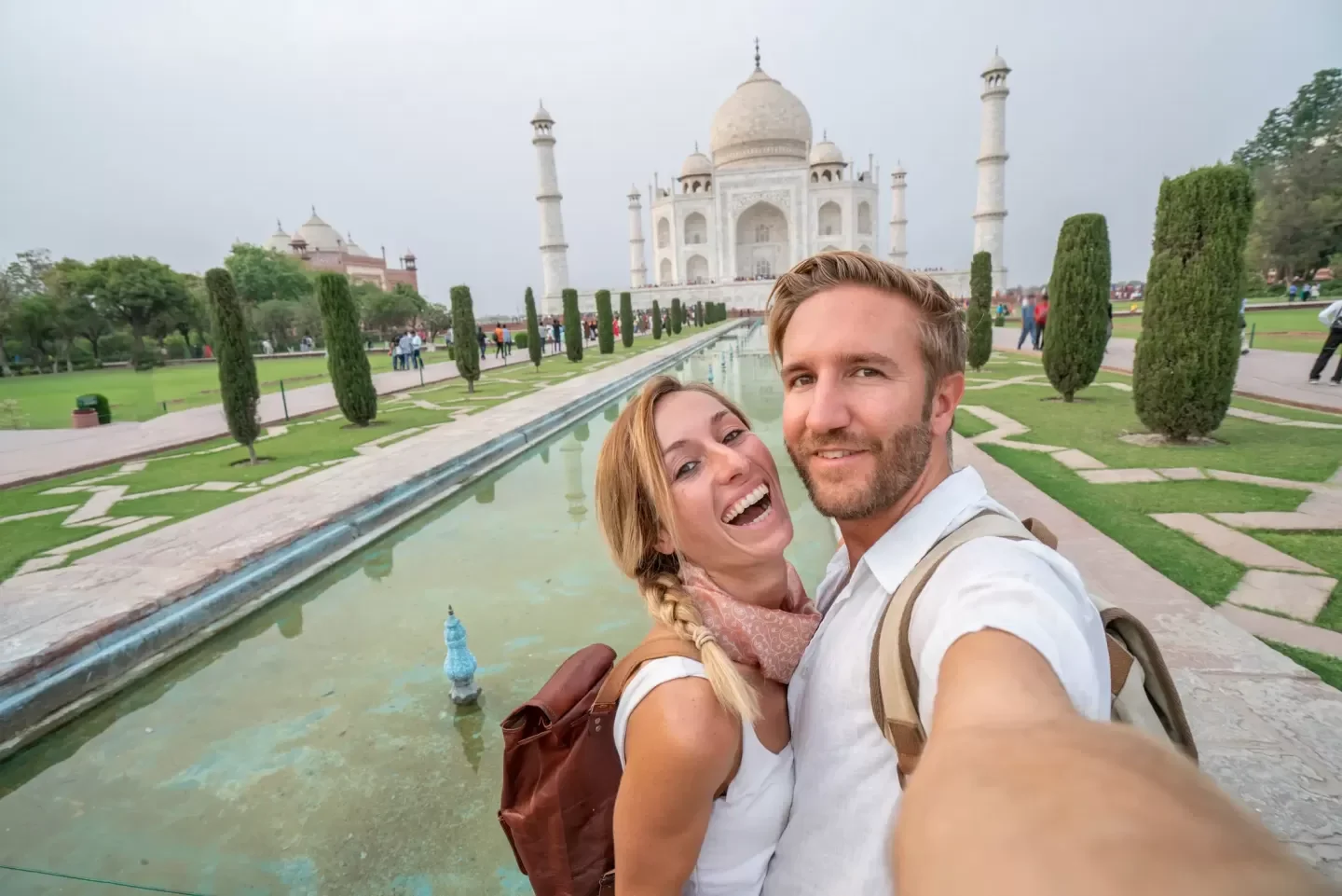 Young couple american taking selfie portrait at the Taj Mahal