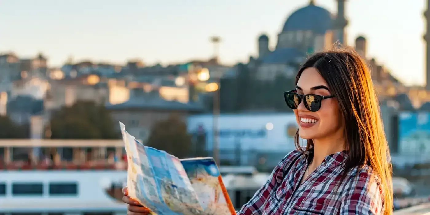 Solo female exploring Istanbul with a map in hand.