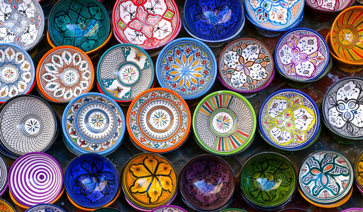 Essaouira, Morocco - October 1, 2018: Moroccan pottery in Essaouira. Colorful ceramics and pottery displayed outside a shop. Beautiful oriental design with plenty of colors