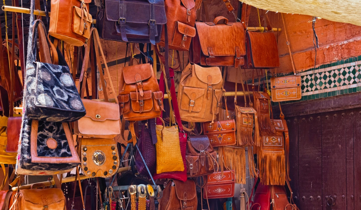The leather handbags in the market place in the medina of Marrakesh on a sunny day