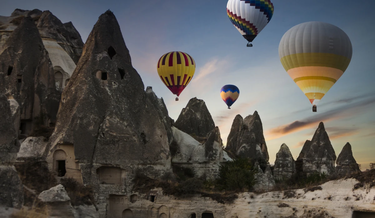 Colorful hot air balloons flying over Cappadocia in the morning