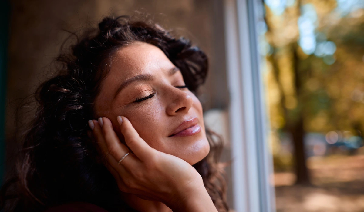 Serene woman enjoying a peaceful moment with closed eyes