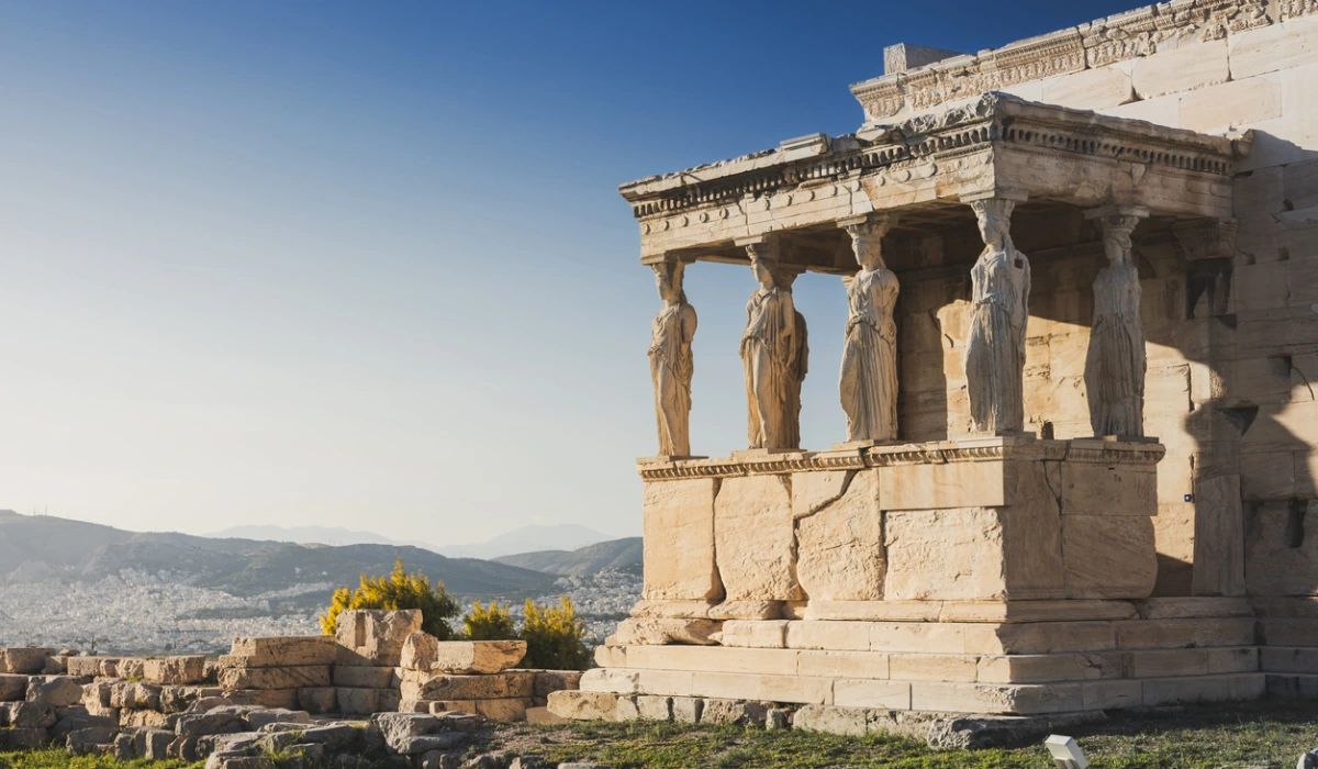 Cariatides Porch, Erechtheion on Acropolis of Athens against blue sky