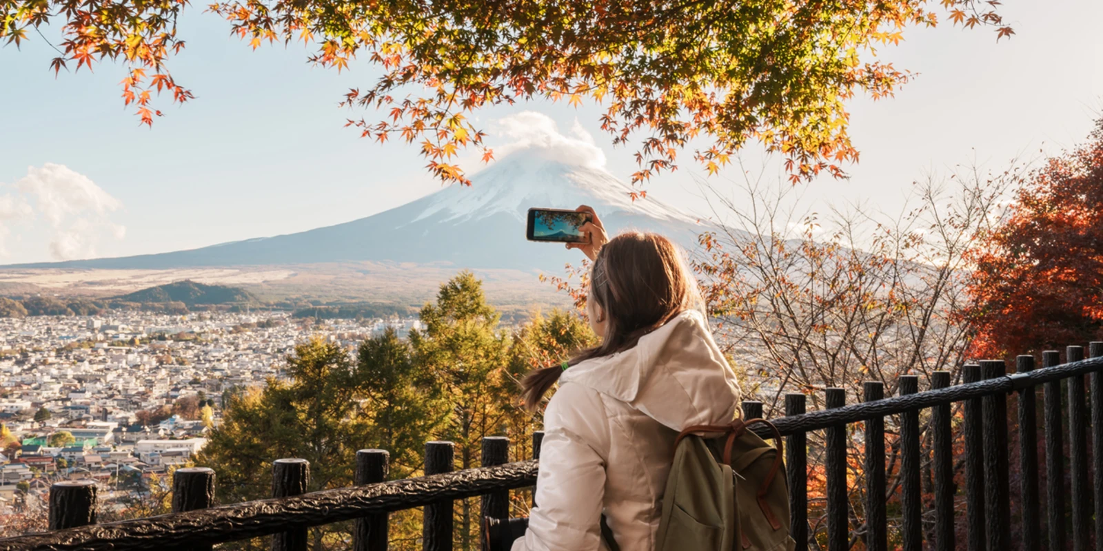 Woman tourist with mount Fuji at Chureito Pagoda in Autumn season, Traveler travel Arakurayama Sengen Park, Yamanashi, Japan. Landmark for tourist attraction. Japan Travel, Destination and Vacation