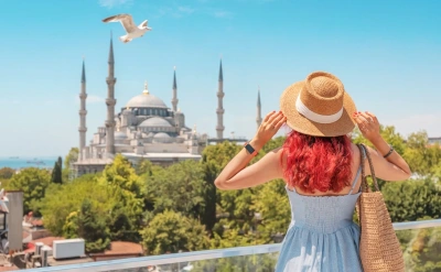 A tourist girl gazes at the Hagia Sophia during her Turkey tour.