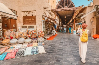 Tourist exploring Old Bur Dubai Souk.