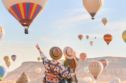 Couple enjoying the view of hot air balloons in Cappadocia