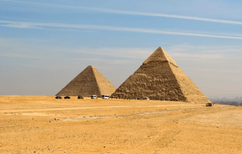 Egypt pyramids at Giza rise from the desert under a clear blue sky, Egypt Cairo to Luxor