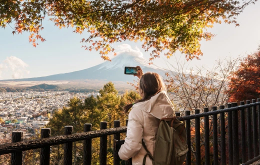 Woman tourist with mount Fuji at Chureito Pagoda in Autumn season, Traveler travel Arakurayama Sengen Park, Yamanashi, Japan. Landmark for tourist attraction. Japan Travel, Destination and Vacation