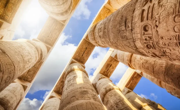 Towering columns and carved reliefs inside Karnak Temple during the Luxor East Bank tour