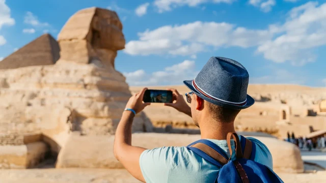 a man taking picture of the sphinx, Cairo Tour