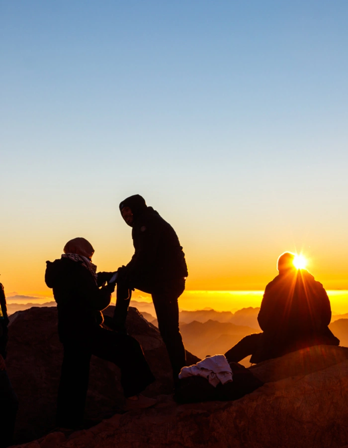 People watching sunrise on the summit of Mount Sinai (Moses Mount) in Egypt