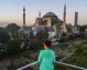 A tourist woman admiring the Hagia Sophia in Istanbul.