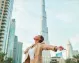 Visitor soaking up Dubai’s energy with the Burj Khalifa in the background.