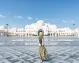 A visitor exploring the stunning Sheikh Zayed Mosque in Abu Dhabi.