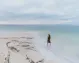 Tourist experiencing the serene beauty of the Dead Sea in Jordan.