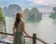 A woman in a dress taking in the beauty of Ha Long Bay.
