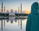 Tourist enjoying the view of the iconic Sheikh Zayed Mosque.