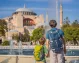 Parent and his child admiring the historic Hagia Sophia in Istanbul.