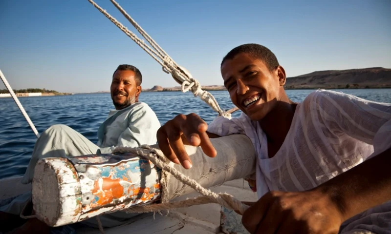 two happy Egyptians on Felucca in Aswan Egypt, Things To Do in Aswan Egypt