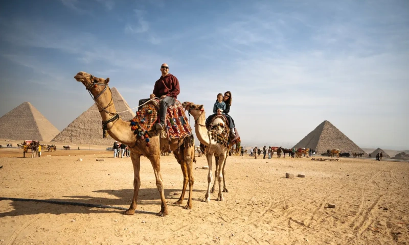 Pyramids of Khufu, Khafre, and Menkaure on the Giza Plateau near Cairo.