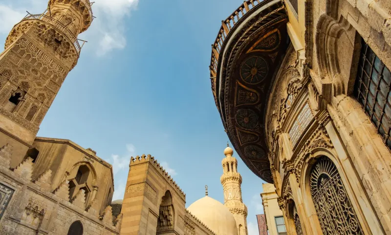 Historic Islamic architecture lining Al-Muizz Street in Cairo.