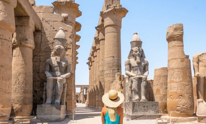 Columns and statues at Luxor Temple on the East Bank of the Nile.