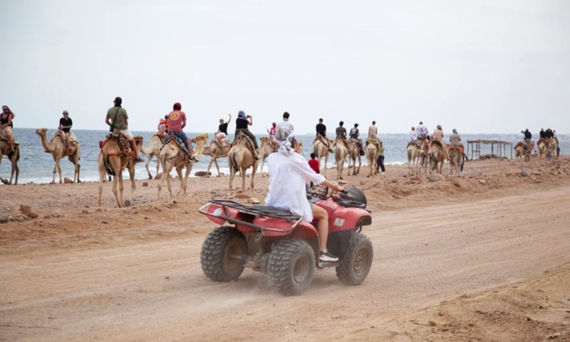 Tourists on ATV safari in the desert, Desert Safari Egypt