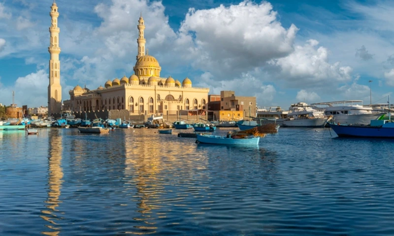 Hurghada mosque reflecting on the red sea with fishing boats, Hurghada City