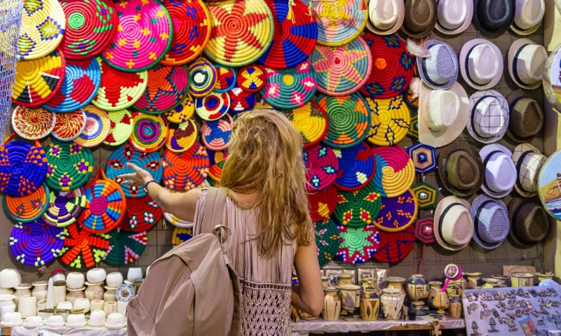Tourist shopping in local market in Aswan city Egypt