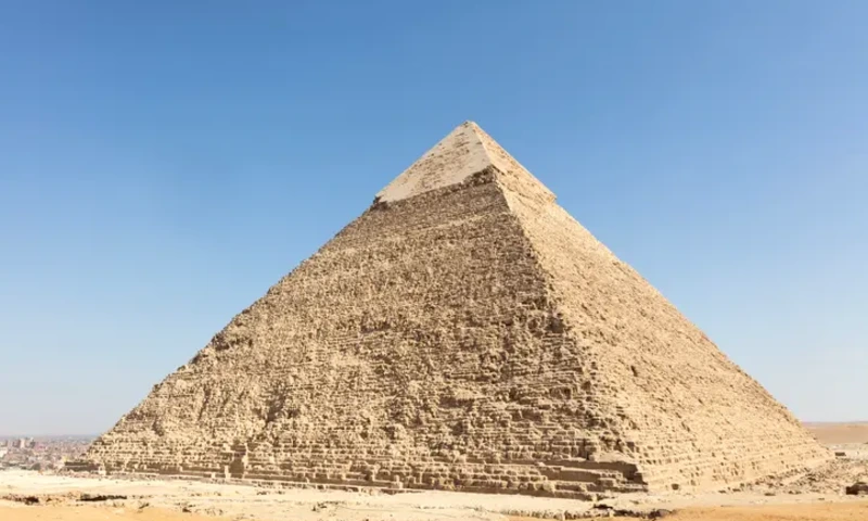 Limestone blocks rising along the exterior of the Great Pyramid of Khufu at Giza.