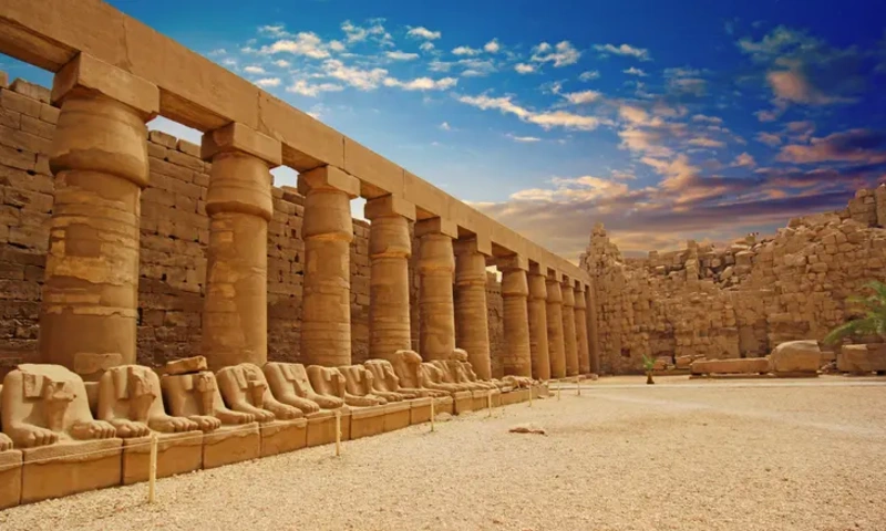 Wide view of Karnak Temple showing monumental stone architecture in Luxor, Egypt.