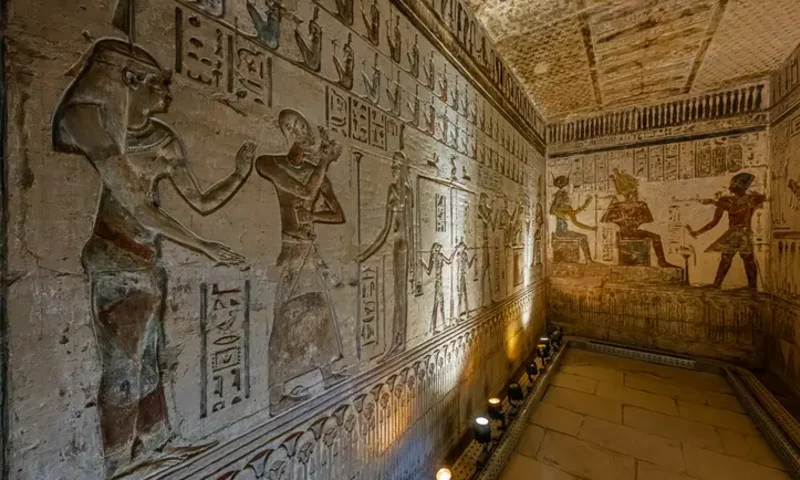 Ancient Egyptian tomb with intricate hieroglyphic carvings on the walls and floor, Egyptian Deities