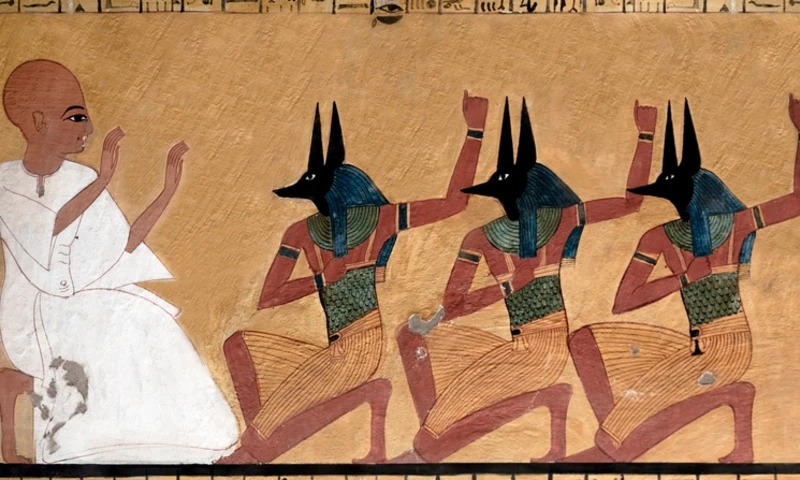 Scene from the tomb of Inherkhau showing him in front of three priests wearing a mask of the god Anubis, Animal Egyptian Gods