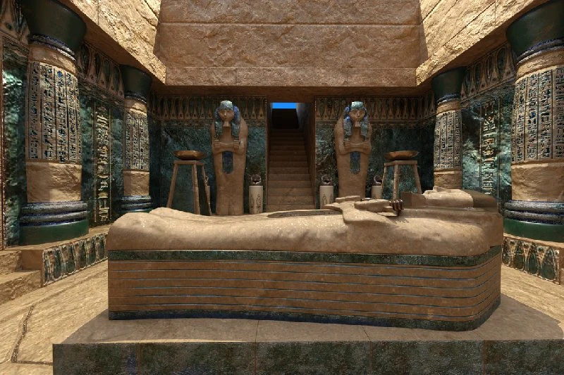 Interior de una tumba egipcia con sarcófago y estatuas guardianas.
