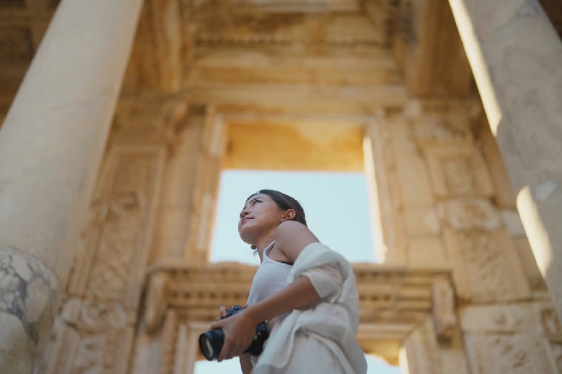 A tourist exploring the historic ruins of Ephesus.