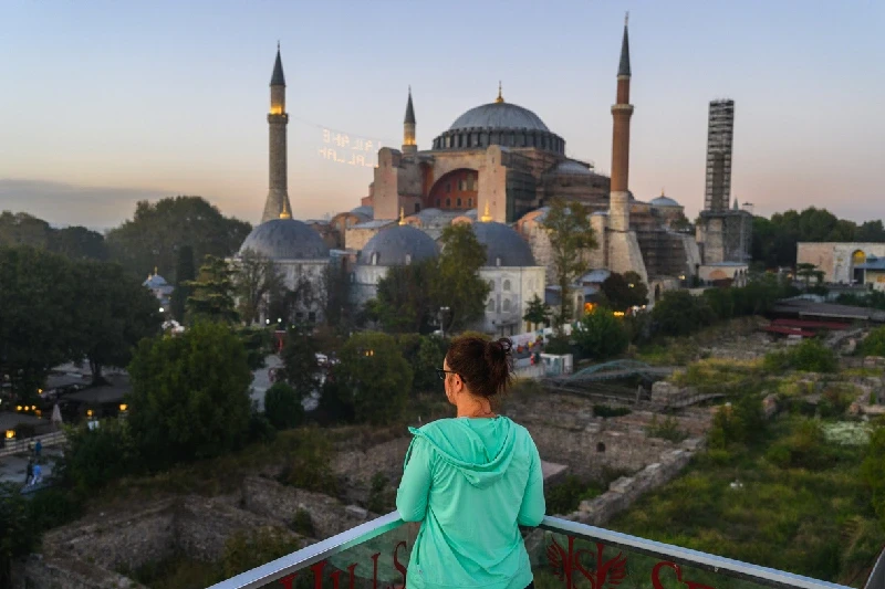 A tourist woman admiring the Hagia Sophia in Istanbul.