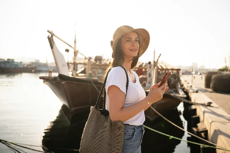 A tourist enjoying the scenic view of Dubai Creek.