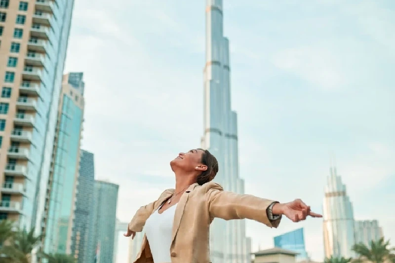 Visitor soaking up Dubai’s energy with the Burj Khalifa in the background.