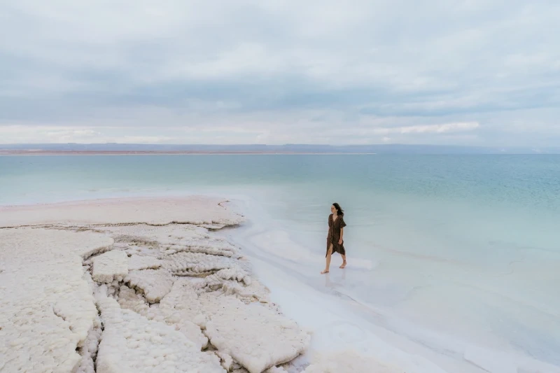 Tourist experiencing the serene beauty of the Dead Sea in Jordan.