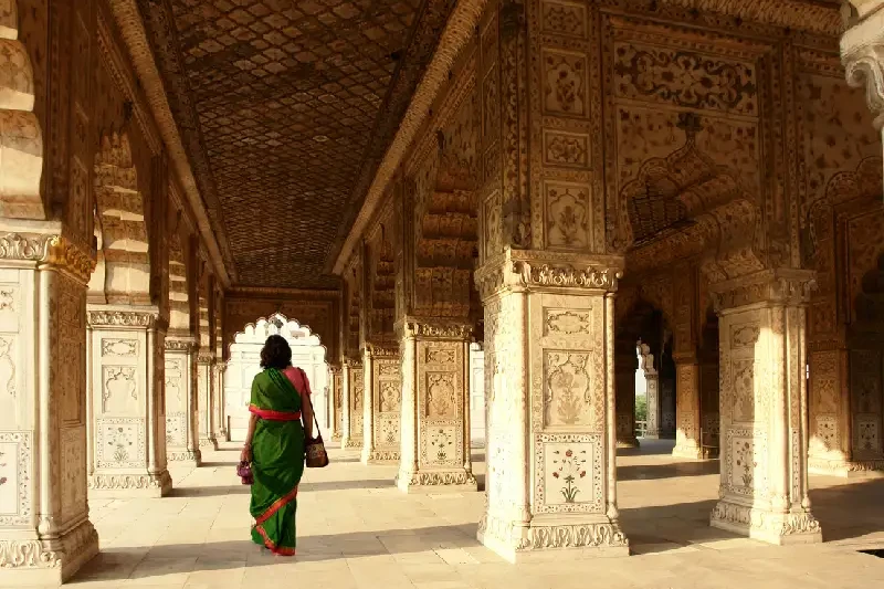 An Indian woman enjoying a walk through the Red Fort, Delhi.