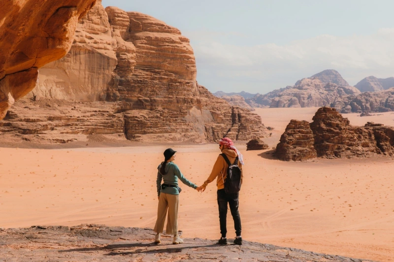 Couple experiencing the iconic desert scenery of Wadi Rum.
