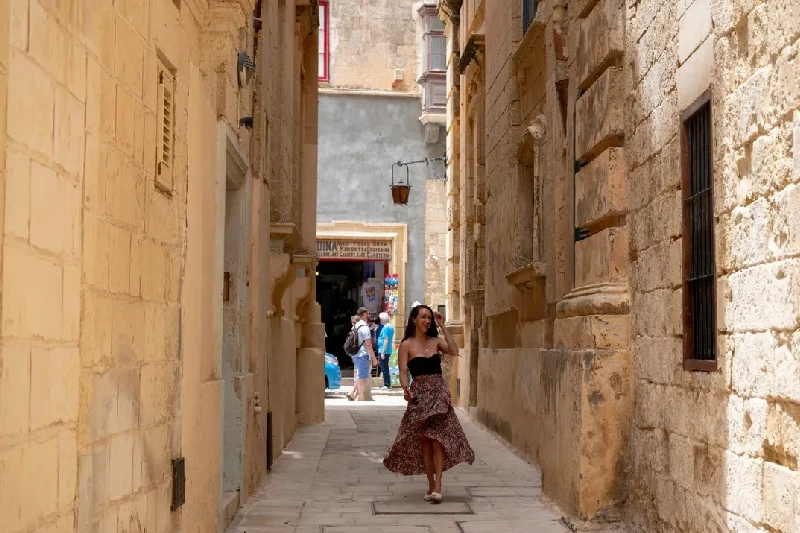 Woman wandering the charming alleys of Rabat’s old city.