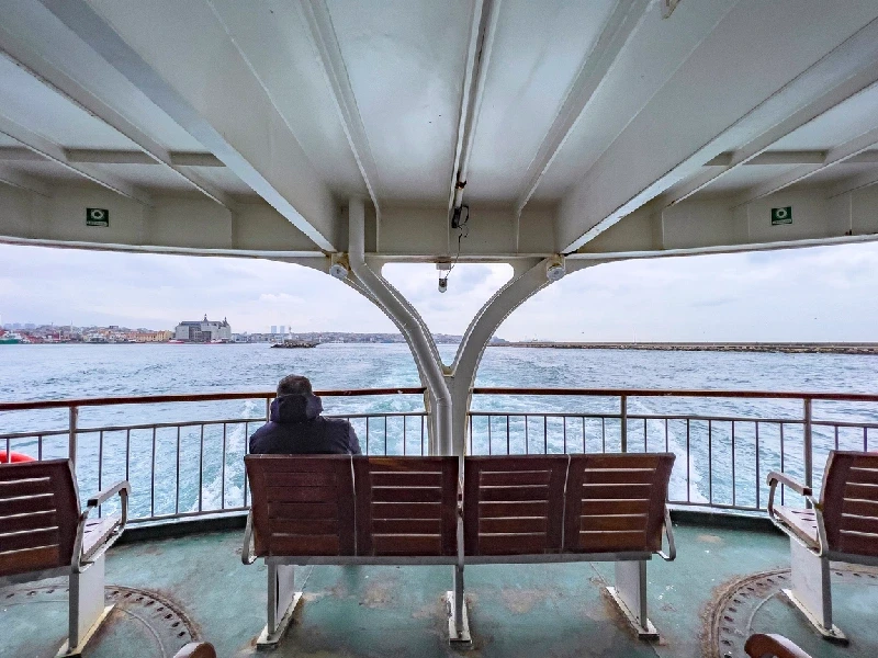 Passenger enjoying the ferry ride in Kadıköy Passenger enjoying the ferry ride in Kadıköy