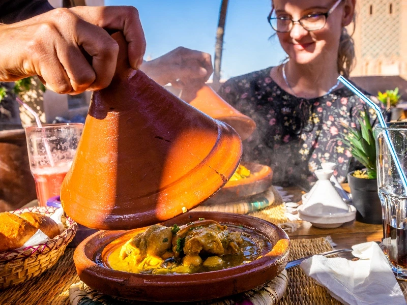 Tourist enjoying Moroccan tagine Tourist enjoying Moroccan tagine